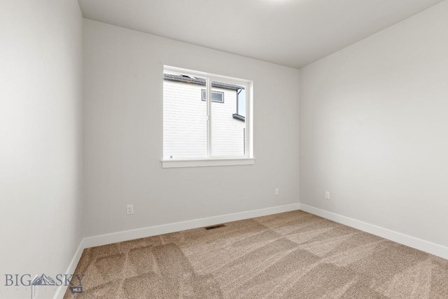 608 Spaniel Ln, Belgrade, MT 59714 - carpeted spare room with baseboards