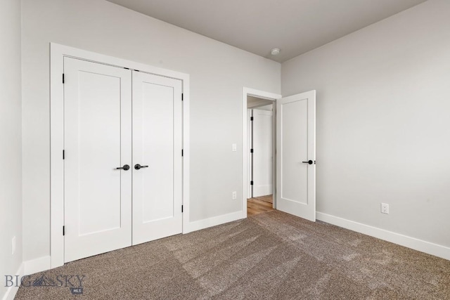 608 Spaniel Ln, Belgrade, MT 59714 - unfurnished bedroom with carpet flooring, baseboards, and a closet