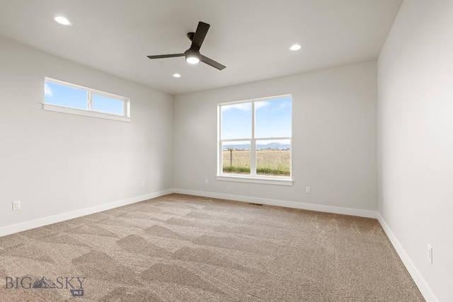 608 Spaniel Ln, Belgrade, MT 59714 - empty room with carpet floors, plenty of natural light, a ceiling fan, recessed lighting, and baseboards