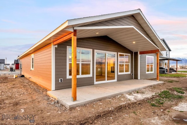 608 Spaniel Ln, Belgrade, MT 59714 - rear view of house featuring a patio area