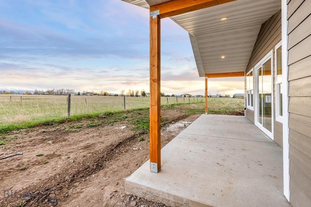 608 Spaniel Ln, Belgrade, MT 59714 - patio terrace at dusk with a patio and a rural view