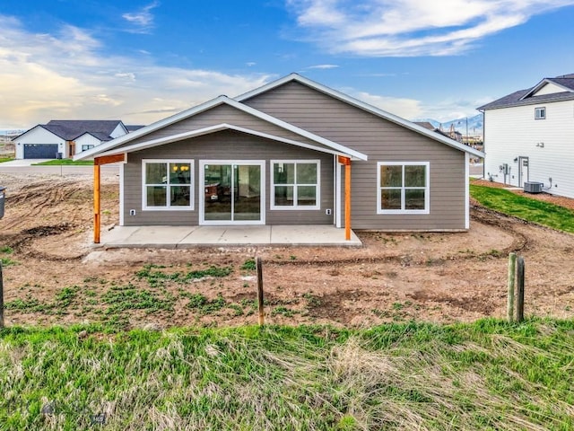 608 Spaniel Ln, Belgrade, MT 59714 - rear view of house featuring a patio and central air condition unit
