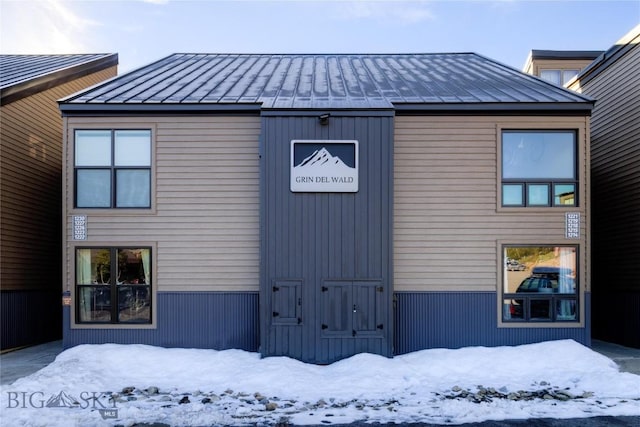21 Sitting Bull Rd Unit 1226, Big Sky, MT 59716 - snow covered house featuring a standing seam roof and metal roof