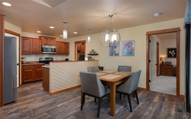 1079 N Cottonwood Rd, Bozeman, MT 59718 - dining area with a chandelier, dark wood-style flooring, recessed lighting, and baseboards
