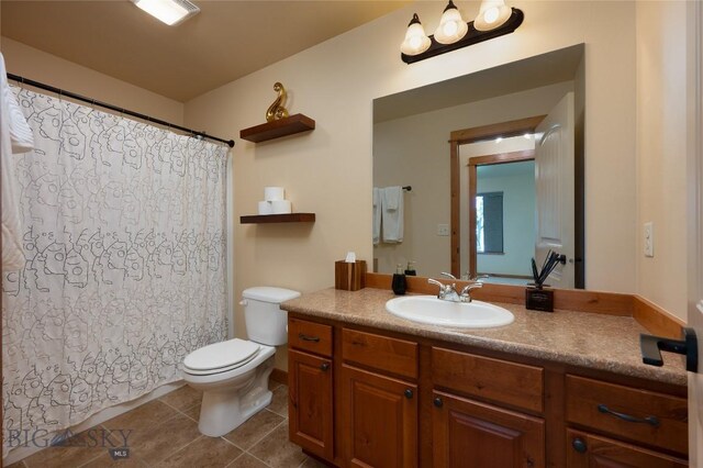 1079 N Cottonwood Rd, Bozeman, MT 59718 - full bath featuring tile patterned flooring, toilet, vanity, and a shower with curtain