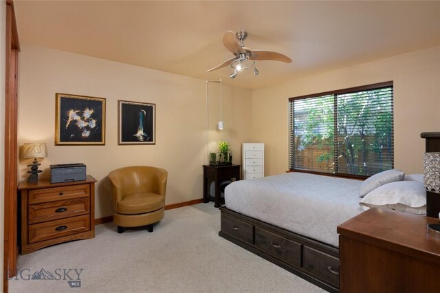 1079 N Cottonwood Rd, Bozeman, MT 59718 - bedroom with light colored carpet, baseboards, and ceiling fan