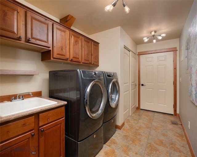 1079 N Cottonwood Rd, Bozeman, MT 59718 - washroom with washing machine and dryer, cabinet space, and baseboards