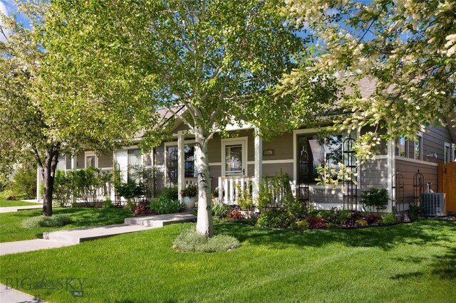 1079 N Cottonwood Rd, Bozeman, MT 59718 - view of property hidden behind natural elements featuring a front lawn and central AC
