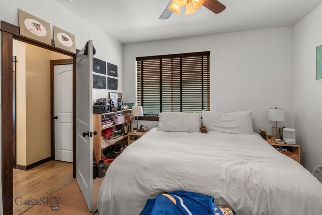 2472 Milkhouse Ave, Bozeman, MT 59718 - bedroom featuring wood finished floors, a ceiling fan, and baseboards