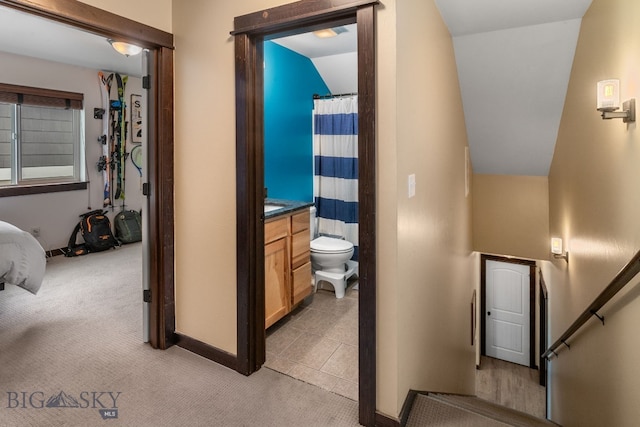2472 Milkhouse Ave, Bozeman, MT 59718 - corridor with light carpet, baseboards, and vaulted ceiling