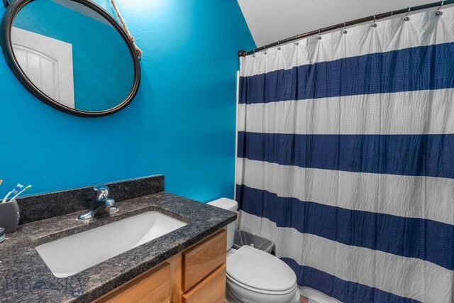 2472 Milkhouse Ave, Bozeman, MT 59718 - bathroom with toilet, vanity, and a shower with shower curtain