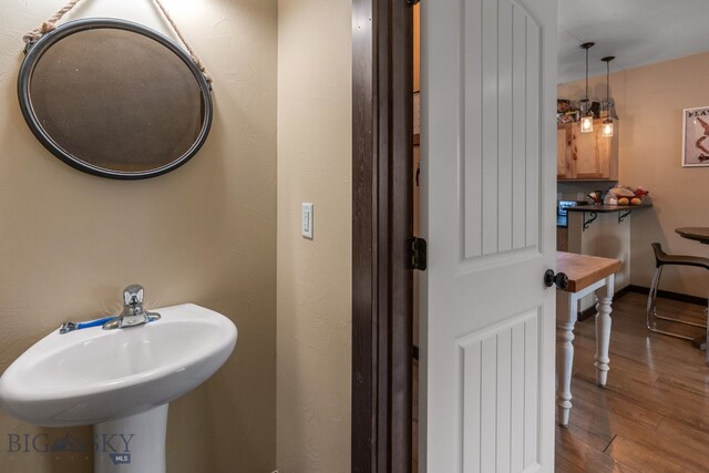 2472 Milkhouse Ave, Bozeman, MT 59718 - bathroom with wood finished floors and a sink