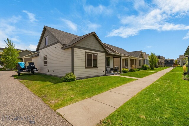 2472 Milkhouse Ave, Bozeman, MT 59718 - view of side of home featuring a lawn
