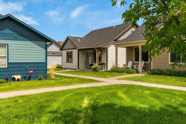 2472 Milkhouse Ave, Bozeman, MT 59718 - ranch-style house with a front lawn, covered porch, and a shingled roof