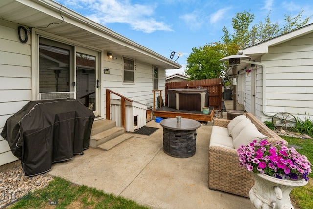 22 Rocky Mountain Dr, Whitehall, MT 59759 - view of patio / terrace featuring a hot tub, outdoor lounge area, and a grill