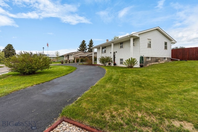 22 Rocky Mountain Dr, Whitehall, MT 59759 - raised ranch with asphalt driveway and a chimney