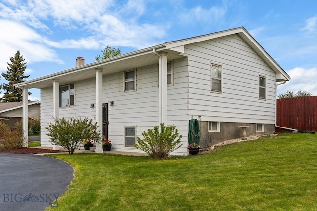 22 Rocky Mountain Dr, Whitehall, MT 59759 - view of side of home featuring a chimney