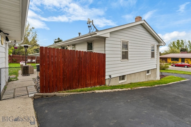22 Rocky Mountain Dr, Whitehall, MT 59759 - view of side of property featuring a chimney
