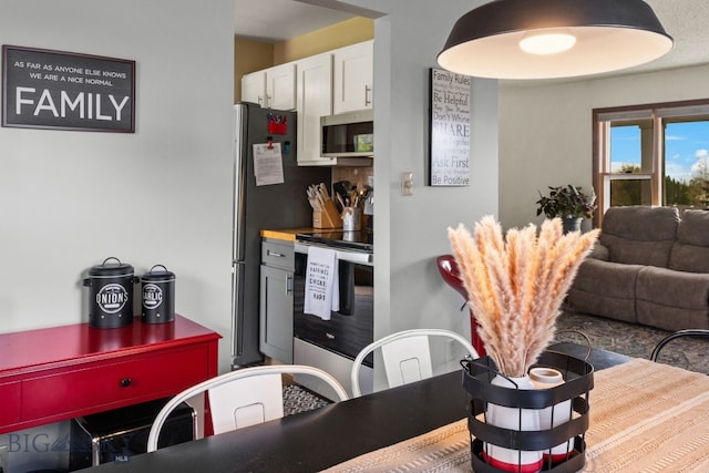 22 Rocky Mountain Dr, Whitehall, MT 59759 - kitchen with stainless steel appliances and white cabinetry