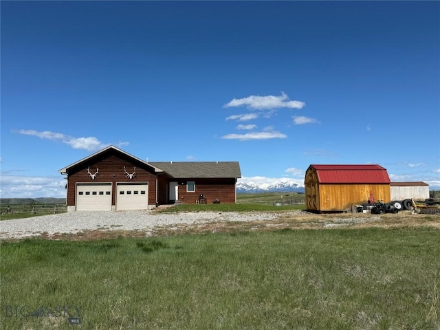 30 Grand View Ln, Big Timber, MT 59011 - view of front of home with an attached garage, a front lawn, and gravel driveway