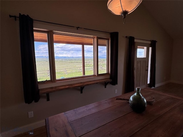 30 Grand View Ln, Big Timber, MT 59011 - unfurnished dining area with baseboards, wood finished floors, and vaulted ceiling