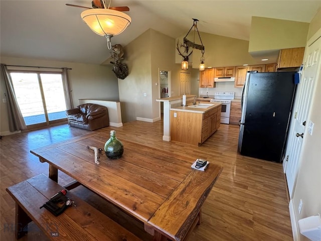 30 Grand View Ln, Big Timber, MT 59011 - dining room featuring baseboards, light wood finished floors, and high vaulted ceiling