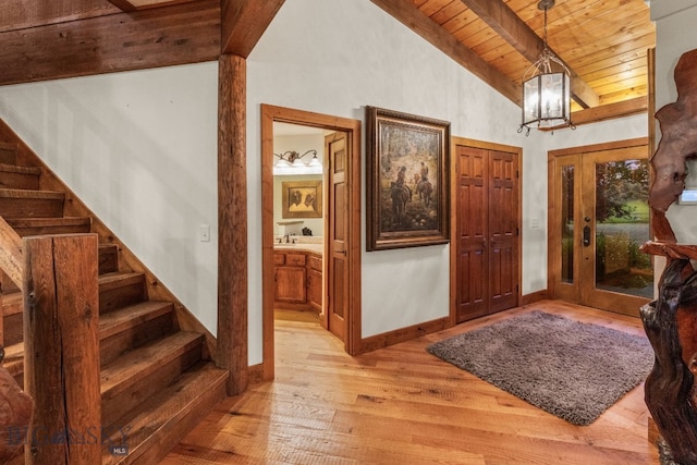 14585 Eagle Eye Way, Gallatin Gateway, MT 59730 - foyer entrance featuring wood ceiling, light wood-style flooring, stairs, and a chandelier