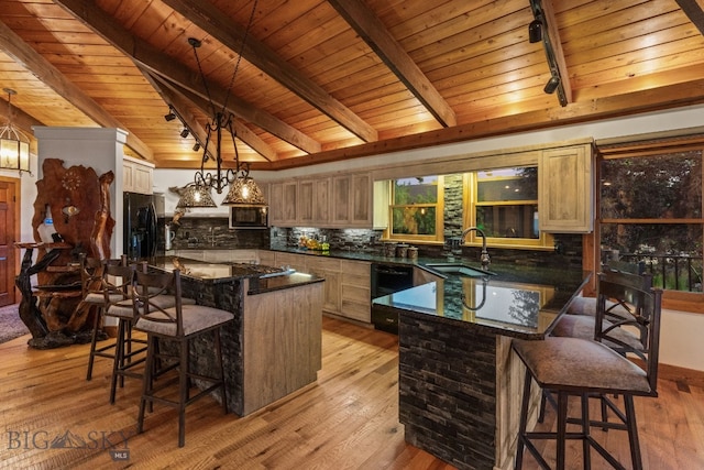 14585 Eagle Eye Way, Gallatin Gateway, MT 59730 - kitchen with a sink, black appliances, a breakfast bar area, wooden ceiling, and decorative backsplash