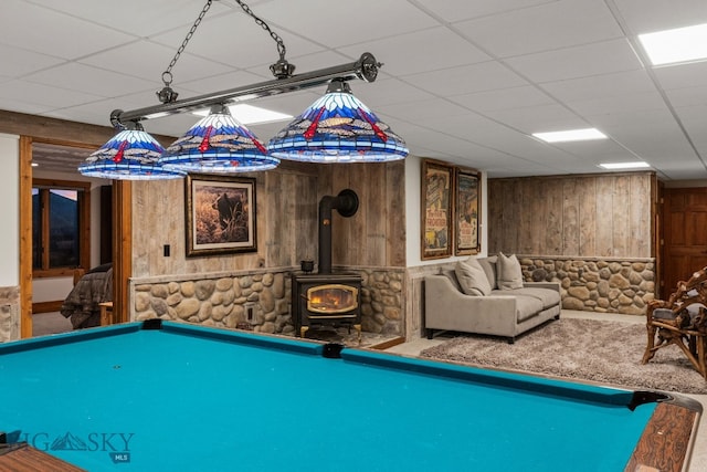 14585 Eagle Eye Way, Gallatin Gateway, MT 59730 - game room featuring wood walls, a wood stove, carpet flooring, billiards table, and a drop ceiling