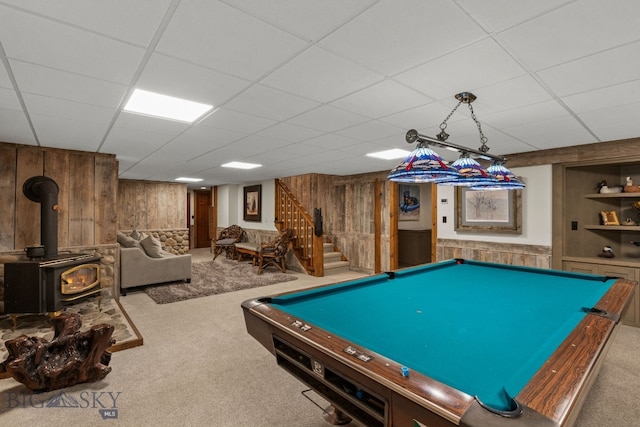 14585 Eagle Eye Way, Gallatin Gateway, MT 59730 - rec room with wooden walls, carpet, a wood stove, pool table, and a paneled ceiling