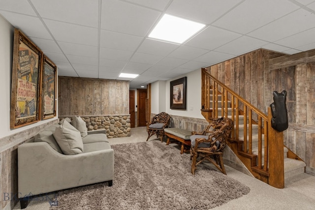 14585 Eagle Eye Way, Gallatin Gateway, MT 59730 - living area with wood walls, carpet, stairs, and a paneled ceiling