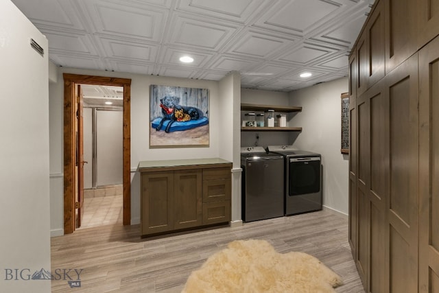 14585 Eagle Eye Way, Gallatin Gateway, MT 59730 - laundry room with washing machine and dryer, recessed lighting, an ornate ceiling, light wood finished floors, and baseboards