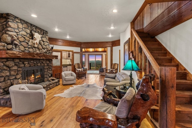 14585 Eagle Eye Way, Gallatin Gateway, MT 59730 - living area with recessed lighting, stairway, wood-type flooring, and a fireplace