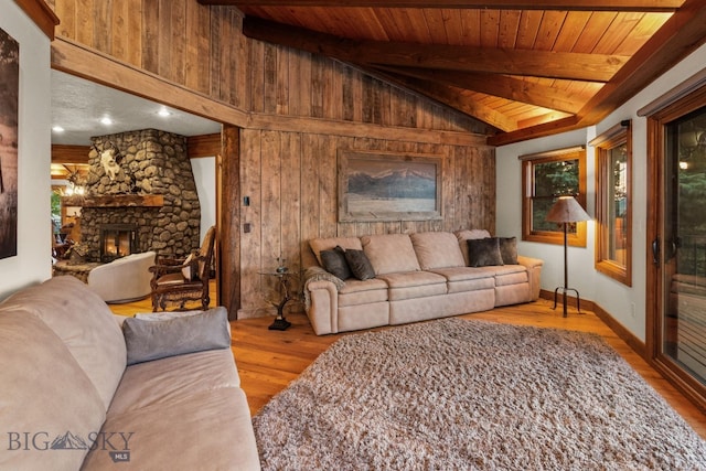 14585 Eagle Eye Way, Gallatin Gateway, MT 59730 - living room with wood finished floors, wooden walls, a fireplace, and wood ceiling