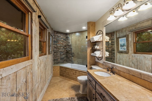 14585 Eagle Eye Way, Gallatin Gateway, MT 59730 - full bath with toilet, vanity, tile patterned flooring, and tiled shower / bath combo