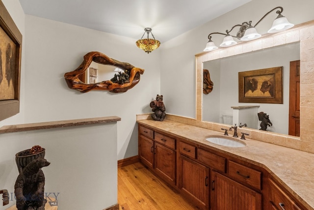 14585 Eagle Eye Way, Gallatin Gateway, MT 59730 - bathroom featuring vanity, wood finished floors, and baseboards