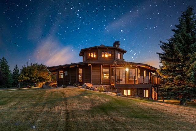 14585 Eagle Eye Way, Gallatin Gateway, MT 59730 - back of property featuring a lawn and a chimney