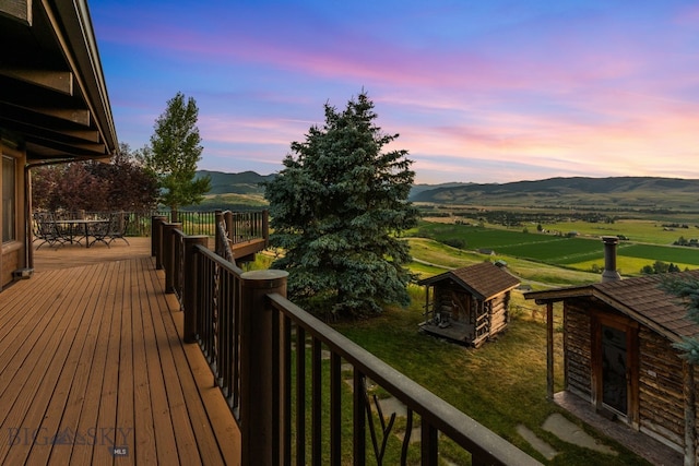 14585 Eagle Eye Way, Gallatin Gateway, MT 59730 - wooden deck with a mountain view and an outbuilding
