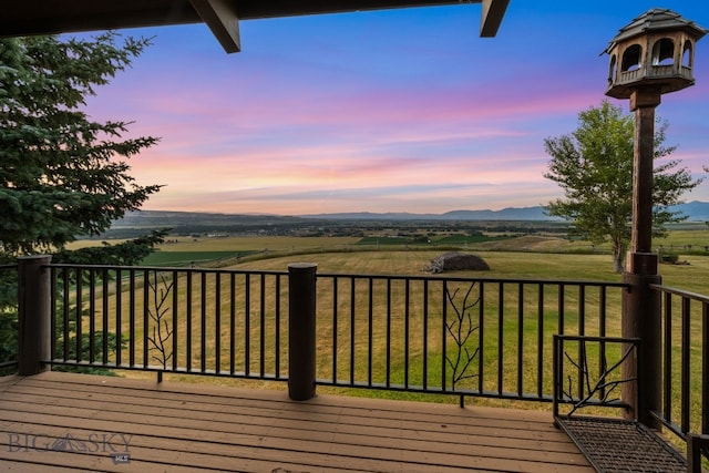 14585 Eagle Eye Way, Gallatin Gateway, MT 59730 - deck at dusk with a rural view and a yard