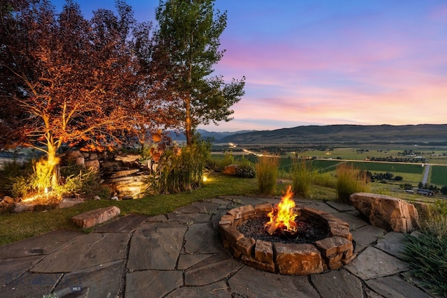 14585 Eagle Eye Way, Gallatin Gateway, MT 59730 - view of patio with a fire pit and a mountain view