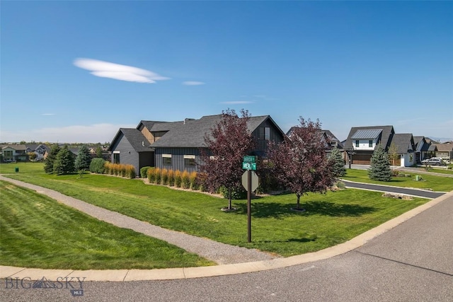 646 Arrow Trl, Bozeman, MT 59718 - view of front facade featuring a residential view, board and batten siding, and a front yard