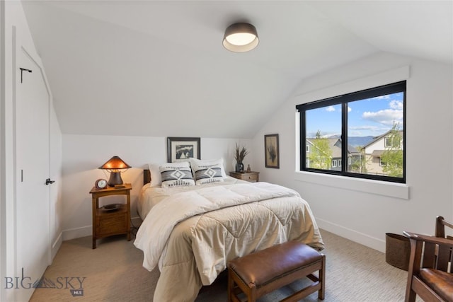 646 Arrow Trl, Bozeman, MT 59718 - bedroom with vaulted ceiling, baseboards, and light carpet