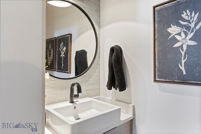 646 Arrow Trl, Bozeman, MT 59718 - bathroom featuring decorative backsplash and vanity