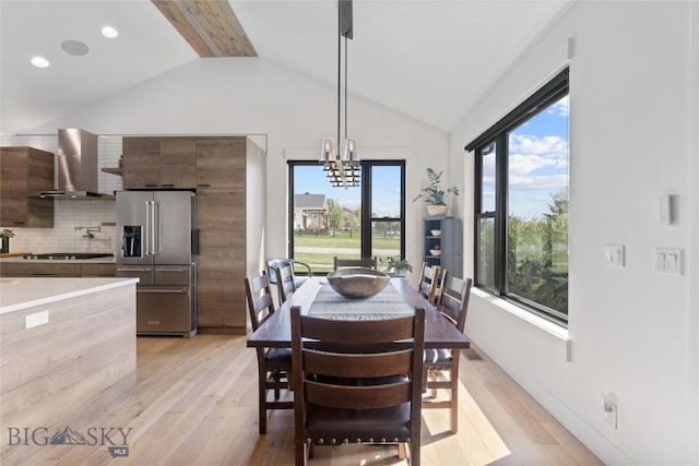 646 Arrow Trl, Bozeman, MT 59718 - dining space featuring lofted ceiling, light wood-style floors, plenty of natural light, a chandelier, and recessed lighting