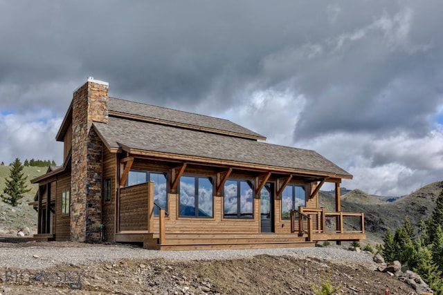 16 Sagittarius Skwy, Emigrant, MT 59027 - rear view of house with a chimney, roof with shingles, and a deck with mountain view