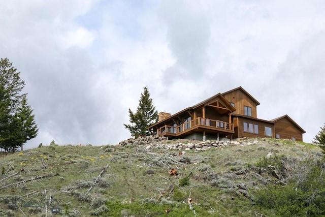 16 Sagittarius Skwy, Emigrant, MT 59027 - rear view of property featuring a chimney