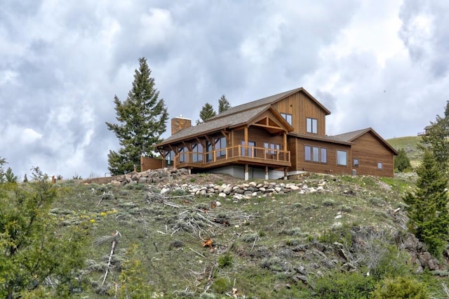 16 Sagittarius Skwy, Emigrant, MT 59027 - back of house with a chimney and a wooden deck