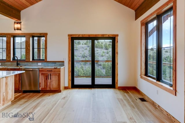16 Sagittarius Skwy, Emigrant, MT 59027 - kitchen featuring dishwasher, wooden ceiling, a sink, light wood finished floors, and brown cabinetry