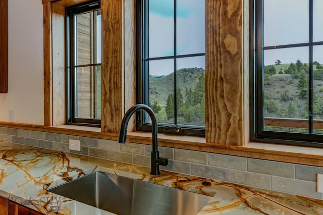 16 Sagittarius Skwy, Emigrant, MT 59027 - kitchen view of a sink, decorative backsplash, and mountains