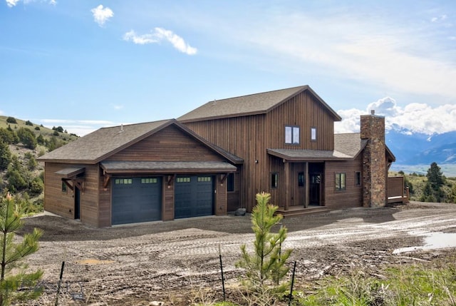 16 Sagittarius Skwy, Emigrant, MT 59027 - view of front of home with a chimney, a shingled roof, and an attached garage